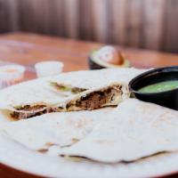 Quesadilla With Meat · Choice of meat, cheese, and guacamole sauce folded in a flour tortilla.