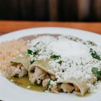 Enchiladas Verdes Plate · Spicy!! Three enchiladas made with your choice of meat, covered in green salsa, cilantro, on...