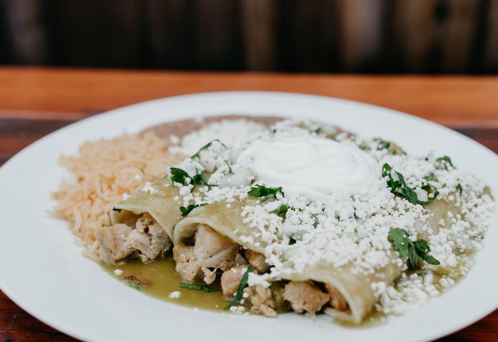 Enchiladas Verdes Plate · Spicy!! Three enchiladas made with your choice of meat, covered in green salsa, cilantro, onion, queso fresco, sour cream, served with rice and beans. Extra toppings for an additional charge.