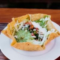 Taco Salad · Corn tortilla bowl that comes with a choice of meat, beans, lettuce, pico de gallo(onion, to...