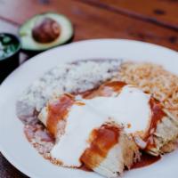 Tamale Plate · Two chicken tamales topped with enchilada sauce, cheese, and sour cream served with beans an...
