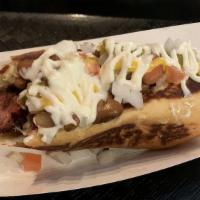 Sonoran Hot Dog · all-beef hot dog wrapped in bacon, grilled onion, pinto beans, raw onion, tomato, jalapeño s...