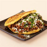 Classic Arepa · Your choice of protein with crumbled cotija cheese and cilantro between two warm, fresh arep...