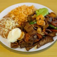 Fajitas Supreme · Shrimp, chicken, steak 
rice, beans, bell pepper, onions,cheese and guacamole
