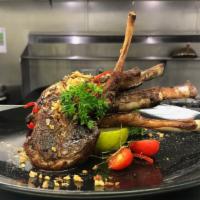 Garlic Lamb Chop · Grilled marinated NZ lamb with crispy garlic.