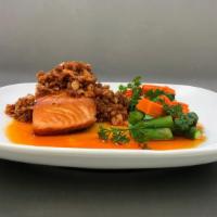 Golden Garlic Salmon · Pan fried salmon with garlic sauce.