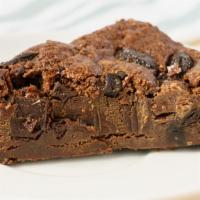 Chocolate Brownie · Housemade decadent chocolate brownie smothered in chocolate chips. For when you need to trea...