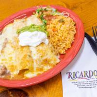 Enchiladas Rancheras · Ranchera sauce and melted cheese over flour tortillas stuffed with beef machaca and cheese. ...