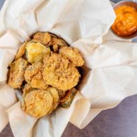 Fried Pickles · Vegetarian. House bread and butter pickles chips with remoulade.