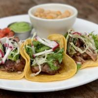 Tres Street Tacos · Choice of topping served with corn tortillas, our white-garbanzo bean medley & salsa.
