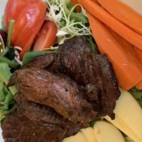 Carne Asada Salad · Grilled, seasoned steak* over a fresh garden salad, sweet potato and apple dressed in a lime...