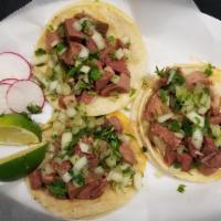 3 Tacos · Street tacos are served in corn tortillas, cilantro, onions, and your choice of meat.