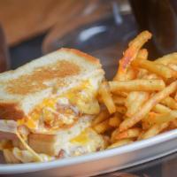 Mac And Cheese Grilled Cheese · Crispy Mac & Cheese Filling, Muenster & Cheddar Cheeses Served on a Toasted Butter Bread wit...
