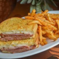 The Count Of Monte Cristo · Shaved Ham, Swiss Cheese, Roasted Garlic & Herb Mayonnaise, Dipped in a Parmesan Herb Egg Wa...