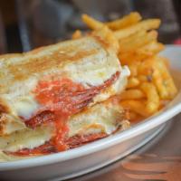 Calzone Grilled Cheese · Sliced Pepperoni and Salami, Tomato Sauce, Ricotta and Mozzarella Cheese.