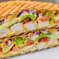 Grilled Chicken Panini · Grilled chicken, mozzarella, tomatoes, onions, green peppers, sun-dried pesto.