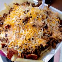 Rosys Fries · Carne Asada, Guacamole, Cheese, Chipotle Sauce, Bacon, and Sour Cream served on top of a Flo...
