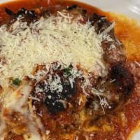 Homemade Lasagna · Ground beef and Italian sausage, baked Provolone and Ricotta cheeses, marinara sauce and mel...