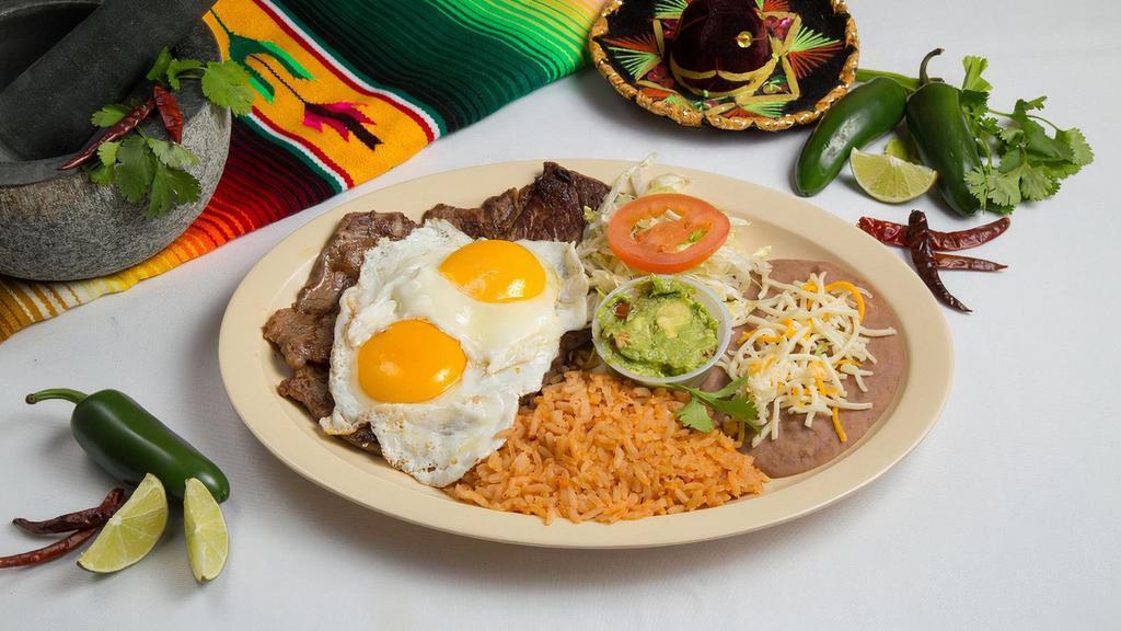 Steak & Eggs Plate · Grilled carne asada steak served with your choice of two prepared eggs, side of guacamole, refried beans, spanish rice, and choice of corn or flour tortillas