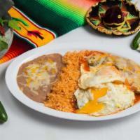 Huevos Rancheros Plate · Two fried eggs served upon lightly fried corn tortillas topped with tomato chili sauce and c...