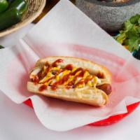Mexican Hot Dog · Fried bacon wrapped hotdog served with mayo, mustard, ketchup, and topped with grilled onions