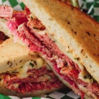 Reuben · Corned beef, sauerkraut, house 1000 island, swiss cheese, locally baked rye.