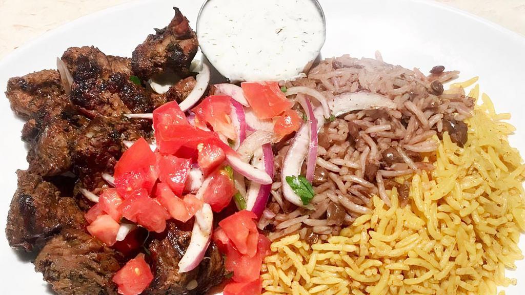 Beef Shish Kabob · (GF) Grilled grass-fed top sirloin Beef Kabob with tomatoes, onions, parsley, Tzatziki, your choice of rice & one side order (includes 1 pita)