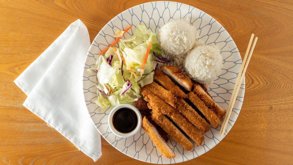 Chicken Katsu Burger · Chicken breast katsu, lettuce, tomato, pickle, red onion, and sauce. Served with French fries.