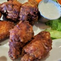 Wings · Over A Pound Of Habanero Seasoned And Breaded Chicken Wings.  With Carrots, Cucumbers + Ranc...