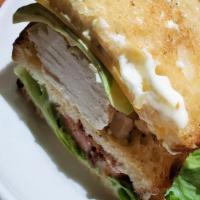Turkey Club · In-House Roasted Turkey Breast, Lettuce, Smoked 
Bacon, Tillamook Cheddar Cheese, Avocado, T...