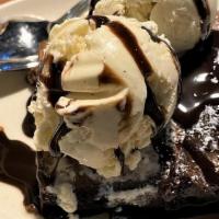 Brownie · Fresh Baked With Callebaut Dark Chocolate.  With Vanilla Bean Ice Cream.