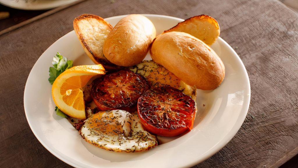 Eggs Provencal Breakfast · Local tomatoes, sautéed with fresh garlic, thyme and farm eggs, served with your choice of toast.