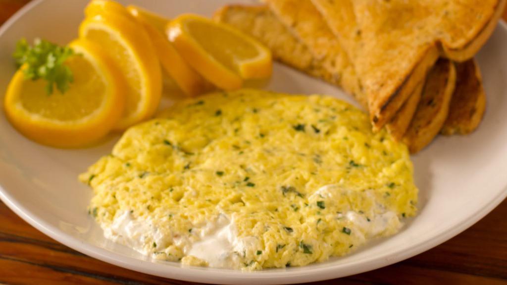 Fresh Herb & Goat Cheese Omelette Breakfast · French goat cheese and fine herbs. Made with three large farm fresh eggs and toast, with your choice of side.