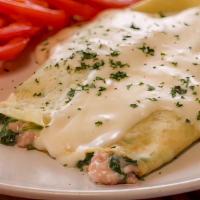 Ham, Spinach & Swiss Crepe Breakfast · Delicate crepes filled with fresh baby spinach, fresh ground ham, Swiss and bechamel cheese....