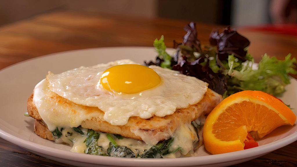 Florentine Croque Madame Breakfast · Fresh baby spinach, layered with bechamel, Gruyere and Parmesan cheese baked on our box French bread.