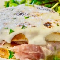 Croque Monsieur Sandwich · Thinly sliced ham, layered with bechamel, Gruyere and Parmesan cheese baked on our square Fr...