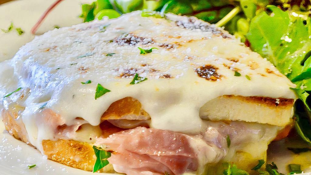 Croque Monsieur Sandwich · Thinly sliced ham, layered with bechamel, Gruyere and Parmesan cheese baked on our square French bread.