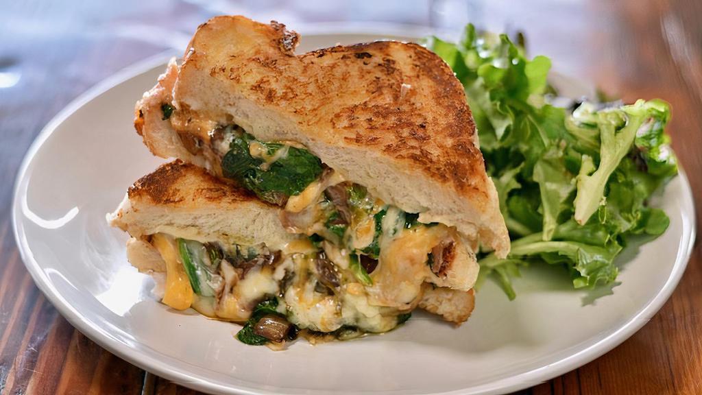 Grown-Up Grilled Cheese Sandwich · Triple cheese, balsamic grilled onions and spinach stuffed into our thick cut French box bread and grilled to perfection.