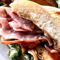 Chicken Cordon Bleu Sandwich · Grilled chicken breast topped with deli ham, grilled local tomato, romaine and melted Gruyer...