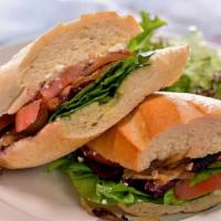 Les Beets & Feta Sandwich · Fresh roasted beets, feta, fresh spinach, grilled onions, local tomato and champagne vinaigr...