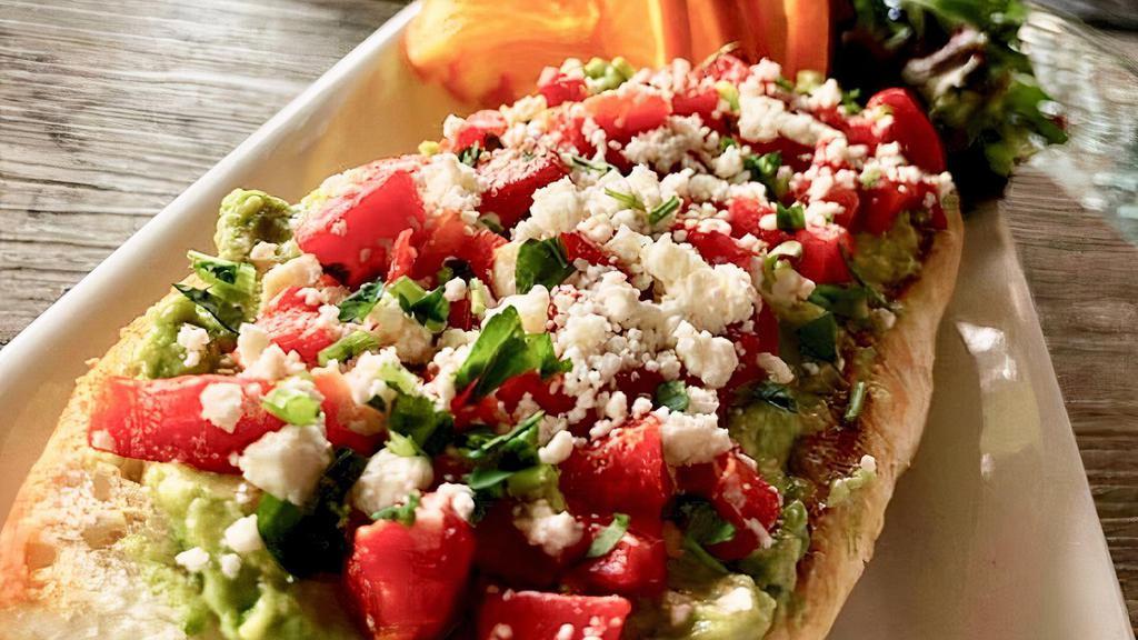 Grilled Avocado Toast · French Baguette grilled and topped with fresh avocado, roasted red peppers and feta cheese.