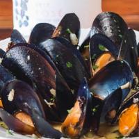 Moules Marinieres (Mussels) · About a pound of Our famous east coast mussels in a Lemon, garlic and white wine creme sauce...