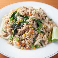 Thai Fried Rice · Thai fried rice with egg, tomatoes, garlic, onions, Chinese broccoli, and black pepper.