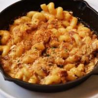 Smoked Bacon Mac & Cheese · Caramelized onions, Parmesan breadcrumbs.