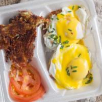 Eggs Benedict · Grilled English muffin halves, Canadian bacon, basted eggs, hollandaise sauce, and chives. S...