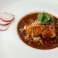 Mole Poblano · Chicken breast slow cooked to perfection, roasted sesame seeds, smothered in our flavorful m...