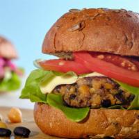 Black Bean Burger With Fries · House special Burger made with a Black Bean veggie patty, and topped with a slice of vegan c...