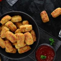 Large Tots · Golden crispy tater tots seasoned and fried to perfection.