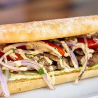 Pollo A La Brasa Sandwich · Lightly fried chicken prepared in a beer marinade, topped with lettuce, tomatoes and criolla...