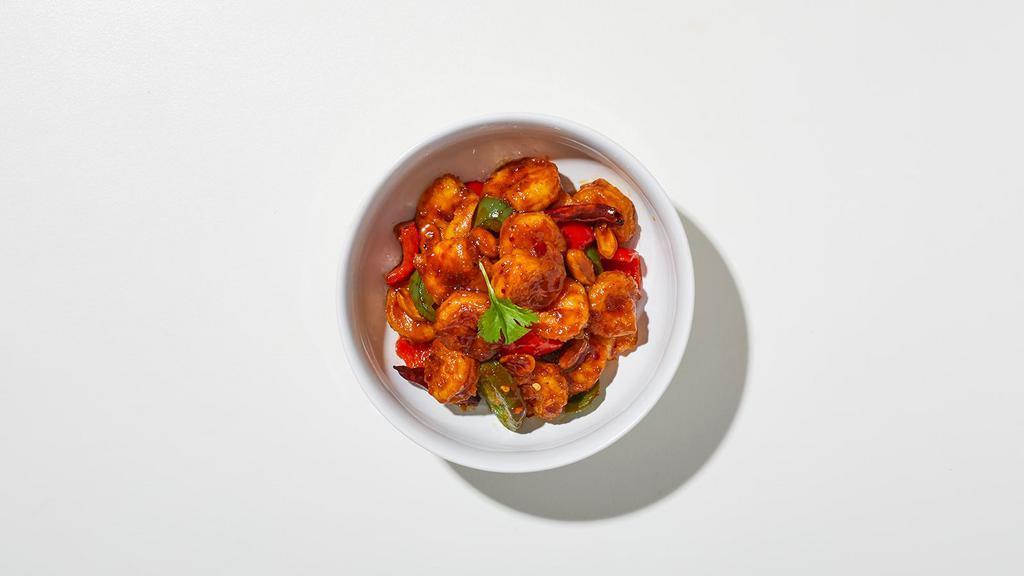 Kung Pao Shrimp · Shrimp sautéed with chili pepper, zucchini, white onions, carrots, and roasted peanuts in chili soy sauce.